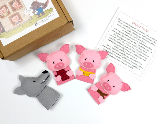 Three Littel pigs finger puppets and a gray wolf puppet with a box & story card by AGD handmade.